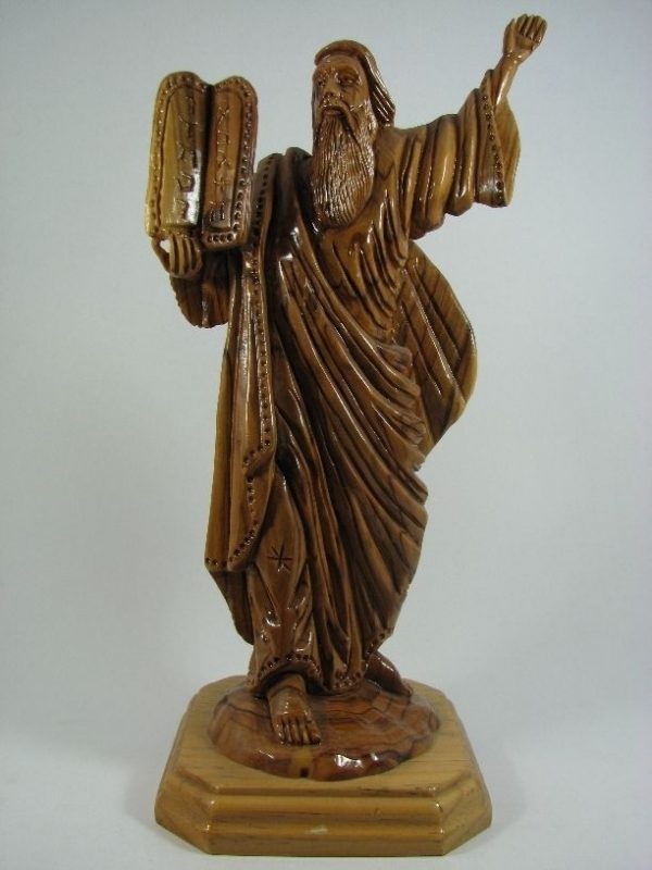 Moses carrying ten commandments